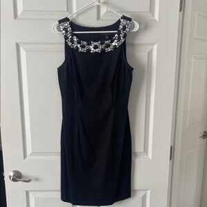 Elegant Black Dress with Embellished Neckline